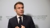 France's President Emmanuel Macron, center, adresses to media during the inauguration of the International Agriculture Fair, in Paris, Feb. 22, 2025.