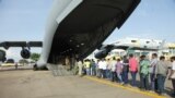 Indian nationals board an Indian Air Force plane July 14, 2016, as they leave Entebbe, Uganda, to go back home after arriving from Juba, South Sudan. India and other nations continue to evacuate citizens from South Sudan, where fears of a return to civil war persist. 