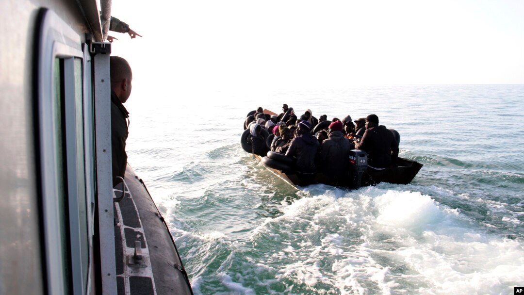 FILE - Migrants, mainly from sub-Saharan Africa, are stopped by Tunisian Maritime National Guard at sea during an attempt to get to Italy, near the coast of Sfax, Tunisia, on April 18, 2023.