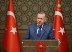 Turkish President Recep Tayyip Erdogan speaks during a meeting at his presidential palace, in Ankara, Turkey, Oct. 24, 2019.