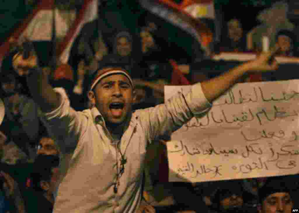 An Egyptian man, flashes the V sign as he celebrates after President Hosni Mubarak resigned and handed power to the military at Tahrir square, in Cairo, Egypt, Friday, Feb. 11, 2011. Egypt exploded with joy, tears, and relief after pro-democracy protester