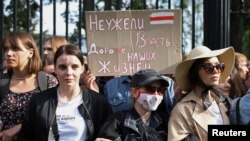 Students protest against presidential election results in Minsk, Belarus, Sept. 1, 2020. The placard reads: "Is power more precious than our lives?"