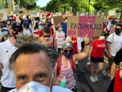 U.S. Senator Mitt Romney marches during a protest against racial inequality in Washington, June 7, 2020.