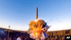 FILE - In this photo taken from Russian Defense Ministry video, Dec. 9, 2020, a rocket launches from missile system as part of a ground-based ICBM test at the Plesetsk facility in northwestern Russia.