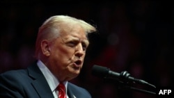 El presidente electo de los Estados Unidos, Donald Trump, durante el acto político celebrado en el Capital One Arena en Washington, el 19 de enero de 2025, un día antes de su ceremonia de investidura. (Foto: AFP)