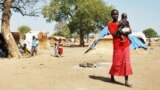 FILE - Darfur's displaced set up huts near and old airstrip in the village of Jaac in southern Sudan.