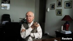 Sartaj Aziz, currently Pakistan's foreign policy chief, gestures during an interview at his office in Lahore in this May 24, 2013, file photo.