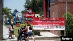 A Wendy’s restaurant displays a "Now Hiring" sign in Tampa, Florida, June 1, 2021. 