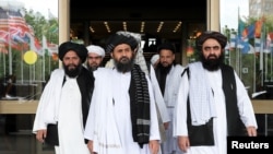 FILE - Taliban delegation leaving after peace talks with Afghan senior politicians in Moscow, Russia May 30, 2019. 
