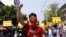 FILE - In this photo taken on March 26, 2021, anti-coup protesters gesture during a march in Yangon, Myanmar.
