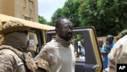 FILE - Col. Assimi Goita, who has declared himself the leader of the National Committee for the Salvation of the People, arrives in the capital Bamako, Mali, Aug. 24, 2020. Goita said May 28, 2021, that a new prime minister will be appointed within days.