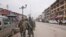 An Indian Central Reserve Police Force (CRPF) personnel frisks a man at a street in Srinagar, Feb. 18, 2019.