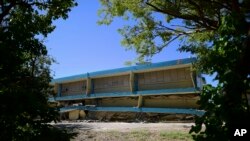 FILE - The Adripina Seda public school stands partially collapsed after an earthquake struck Guanica, Puerto Rico, Jan. 7, 2020.