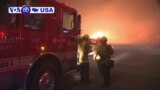 VOA60 America - hot and windy conditions are causing wildfires to spread through northern Los Angeles