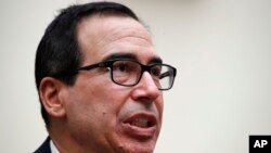 Treasury Secretary Steven Mnuchin speaks to the House Financial Services Committee, July 12, 2018, on Capitol Hill in Washington.