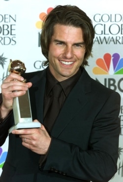FILE - Actor Tom Cruise holds his Golden Globe award for Best Performance by an Actor in a Supporting Role in a Motion Picture Drama for his role in "Magnolia" at the Golden Globe awards in Beverly Hills, Calif., January 2000.