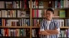 Yu Miao, owner of JF Books, poses for a photo in his bookstore in Washington, Oct. 3, 2024. 