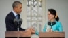 U.S. President Barack Obama, left, and Myanmar's opposition leader Aung San Suu Kyi shake hands during a news conference at her home in Yangon, Myanmar, Nov. 14, 2014.