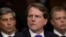 FILE - White House Counsel Don McGahn listens to Judge Brett Kavanaugh as he testifies before the Senate Judiciary Committee during his Supreme Court confirmation hearing on Capitol Hill, Sept. 27, 2018.