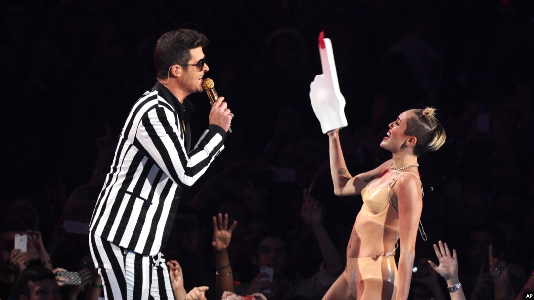 From left, Robin Thicke and Miley Cyrus perform "Blurred Lines" at the MTV Video Music Awards on Aug. 25, 2013, at the Barclays Center in the Brooklyn borough of New York.