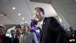 UN General Secretary Ban Ki-Moon (R) is welcomed by Irina Bokova, Director General of UNESCO, at the UNESCO headquarters in Paris, October 9, 2012.