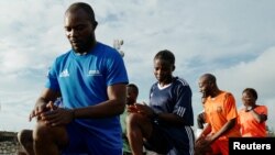 FILE - Congolese International referee Rachel Zihindula 24, participates in a training exercise alongside other referees at the Stade de l'Unite, a multi-use stadium in Goma, Democratic Republic of Congo May 2, 2023.