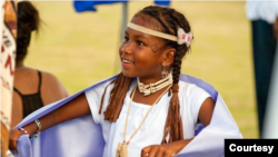 A young St. David's Islander learns the Wampanoag Blanket Dance at the Bermuda Pow Wow, June 25, 2015.