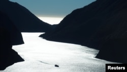 A cruise ship sails into Milford Sound New Zealand, March 7, 2017. 