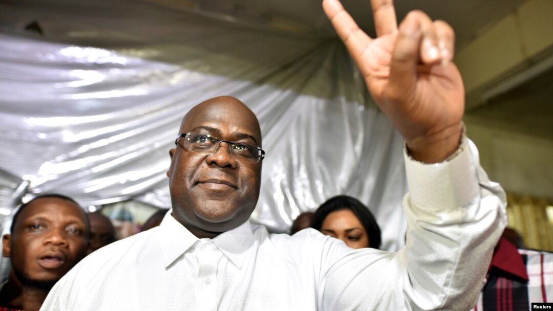 FILE - Felix Tshisekedi, leader of the Congolese main opposition party, was announced as the winner of the presidential elections. He gestures to his supporters at the party headquarters in Kinshasa, Democratic Republic of Congo, Jan. 10, 2019.