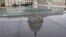 The dome of the Capitol is reflected in a skylight of the Capitol Visitor's Center in Washington, January 1, 2013.