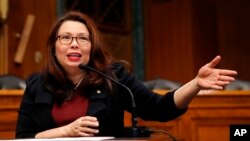 FILE - Sen. Tammy Duckworth, D-Ill., speaks on Capitol Hill, in Washington, Feb. 14, 2018.