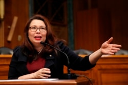 FILE - Sen. Tammy Duckworth, D-Ill., speaks on Capitol Hill, in Washington, Feb. 14, 2018.