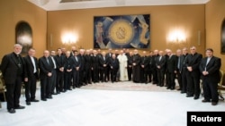 Pope Francis poses with Chilean bishops after a meeting at the Vatican, May 17, 2018. 