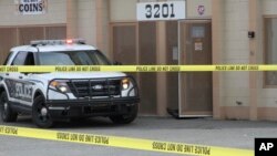 Police respond to a shooting at a precious metals shop in Anchorage, Alaska, Sept. 12, 2017.