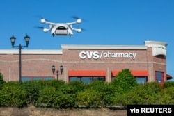 A UPS Flight Forward drone takes off during the first residential delivery of prescription medication for CVS in Cary, North Carolina, Nov. 1, 2019. 