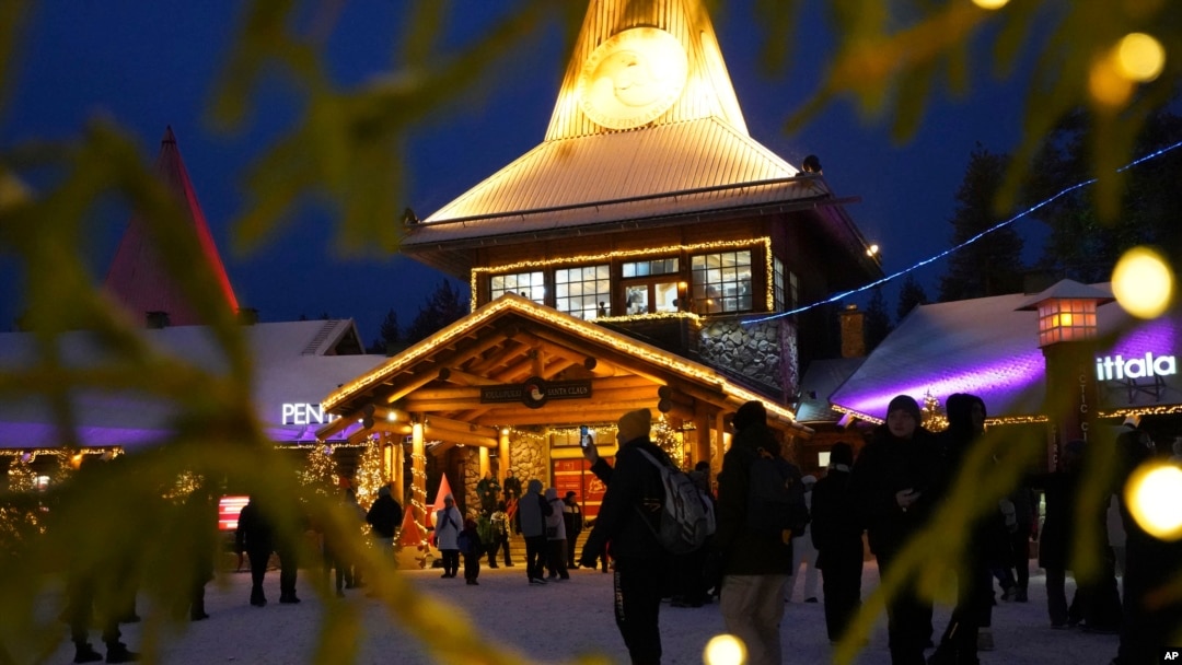 Tourists gather at Santa Claus Village, a winter-themed amusement park perched on the edge of the Arctic Circle, in Rovaniemi, Finland, Dec. 4, 2024. 