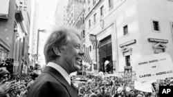 FILE - An estimated crowd of 35,000 people gather for a noontime speech by Presidential candidate Jimmy Carter in downtown Philadelphia, Oct. 29, 1976.