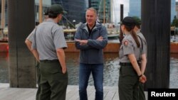 U.S. Interior Secretary Ryan Zinke, center, talks to National Park Service rangers while traveling for his National Monuments review process, in Boston, June 16, 2017.