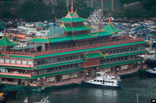 Hong Kong's iconic restaurant on Tuesday departed the city, after its parent company failed to find a new owner and lacked funds to maintain the establishment amid months of COVID-19 restrictions. (AP Photo/Kin Cheung)