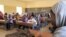 FILE - Schoolchildren listen to a teacher during class in Douentza, Mali. In schools funded by radical Islamists, girls must wear veils and are seated separately in the back or coming at different times altogether.