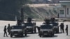 Thai Army soldiers stand on the Thai side of the border crossing in Chong Kaep town as they wait for the arrival of alleged victims from scam centres in Myanmar, in Phop Phra district in Thailand's Tak province, Feb. 12, 2025. 