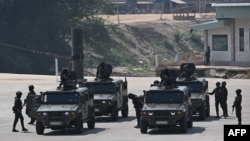 Thai Army soldiers stand on the Thai side of the border crossing in Chong Kaep town as they wait for the arrival of alleged victims from scam centres in Myanmar, in Phop Phra district in Thailand's Tak province, Feb. 12, 2025. 