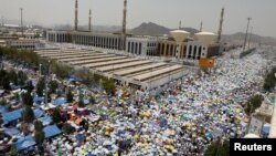 Muslim pilgrims pray outside Namira Mosque on the plains of Arafat during the annual haj pilgrimage, outside the holy city of Mecca, Saudi Arabia, Aug. 31, 2017.