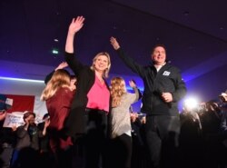 Andrew Scheer, Leader of The Progressive Conservative Party of Canada and his wife Jill, with two of their children, wave to the crowd at a rally in Richmond, British Columbia, Oct. 20, 2019.