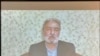 In this image from a video message, former Iranian political prisoner Abbas Vahedian Shahroudi addresses a human rights conference hosted by Washington's National Press Club on June 30, 2021. (Michael Lipin/VOA)