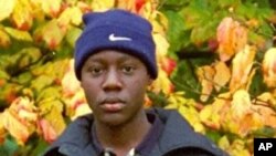 In this 2001 image made available Dec. 28, 2009 by teacher Mike Rimmer, Nigerian Umar Farouk Abdulmutallab poses with a group of fellow pupils from Lome's International School, Togo, while on a school trip to London.