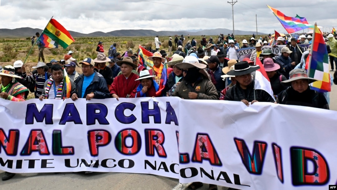 Supporters of Bolivia's former President Evo Morales take part in a march against the government of Luis Arce and to denounce the country's current economic crisis, on the La Paz-Oruro highway, near the town of Ayo Ayo, Bolivia, Jan. 11, 2025.