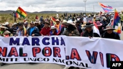 Supporters of Bolivia's former President Evo Morales take part in a march against the government of Luis Arce and to denounce the country's current economic crisis, on the La Paz-Oruro highway, near the town of Ayo Ayo, Bolivia, Jan. 11, 2025.