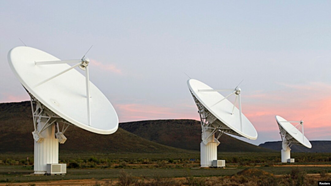 FILE - Radio telescope dishes of the KAT-7 Array at the proposed South African site for the Square Kilometre Array (SKA) telescope near Carnavon in the country's remote Northern Cape province, May 17, 2012. 