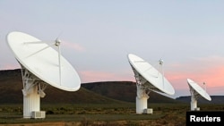 FILE - Radio telescope dishes of the KAT-7 Array at the proposed South African site for the Square Kilometre Array (SKA) telescope near Carnavon in the country's remote Northern Cape province, May 17, 2012. 